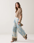 Load image into Gallery viewer, Lined trousers with beach print